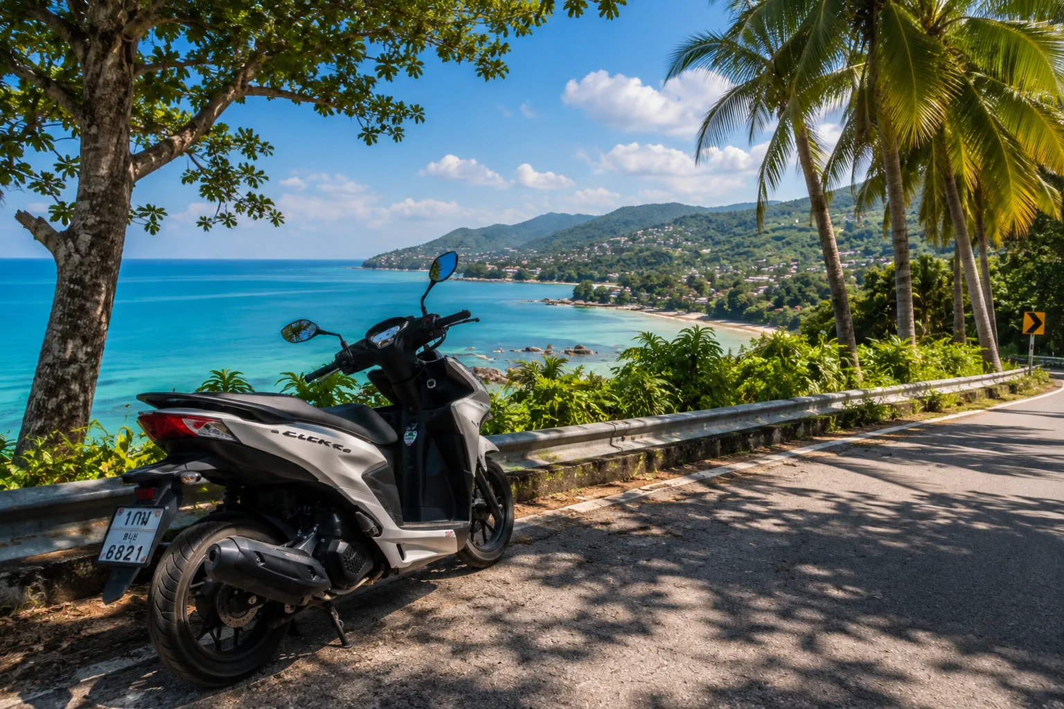 Scooter parked beside a scenic coastal road in Koh Samui